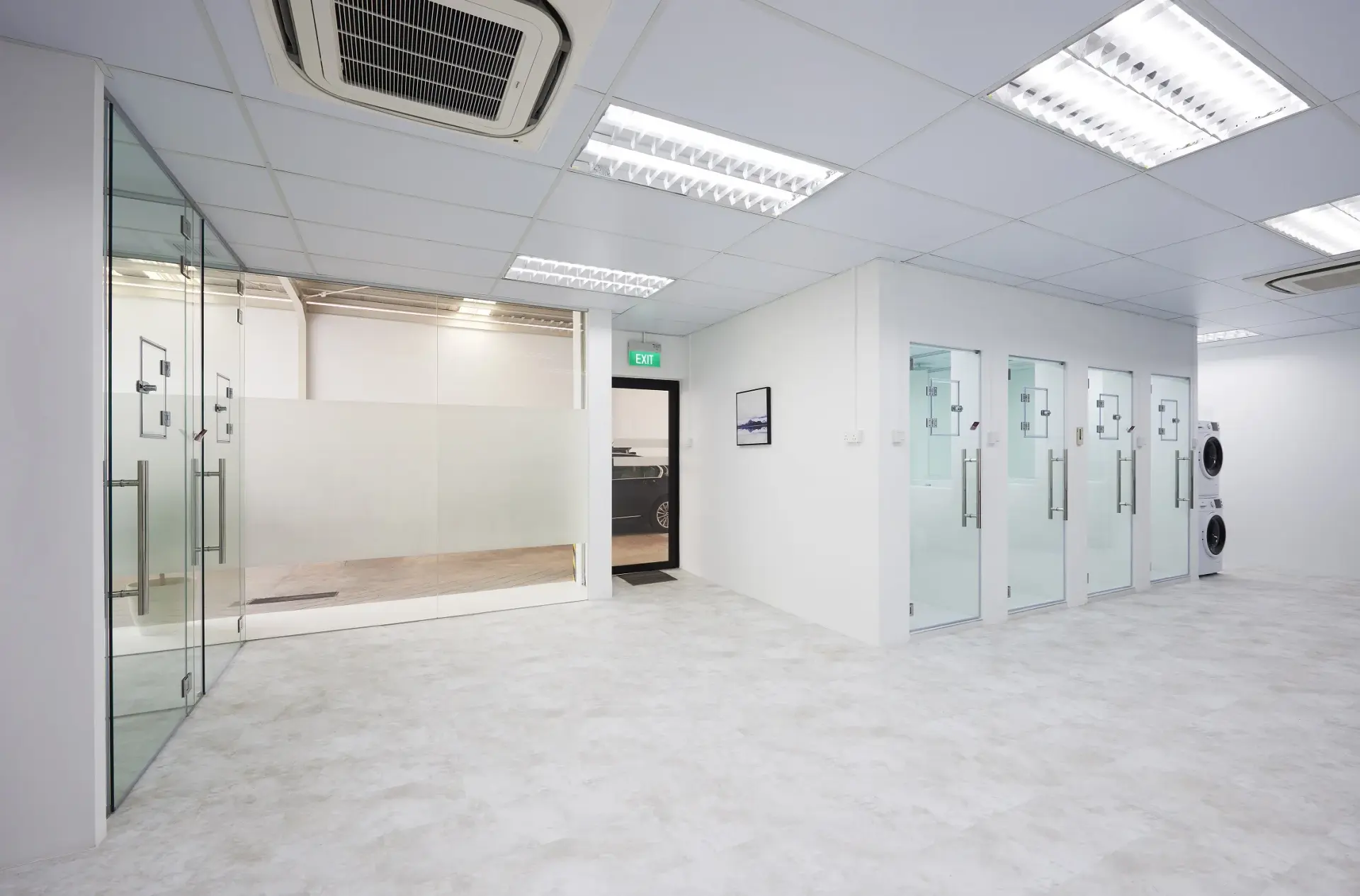Open plan collaboration zone and office lounge area featuring custom commercial office renovation at Bell Flavors & Fragrances Singapore.