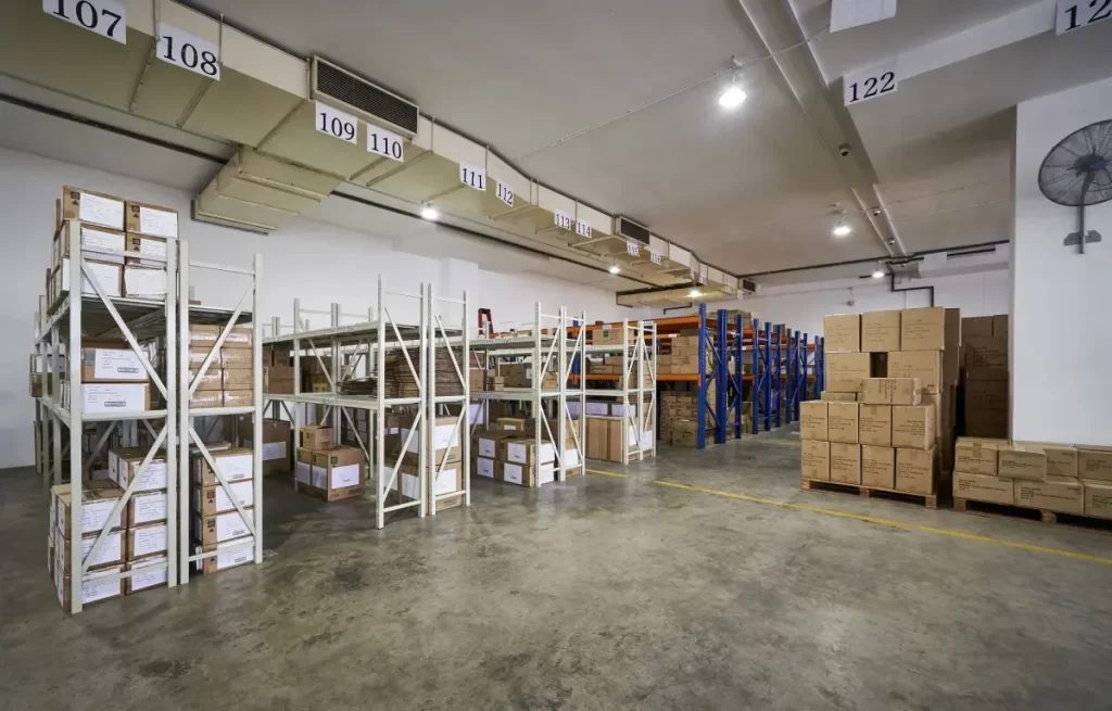 Functional warehouse workspace area supporting interior design company singapore at Megcorp & Co Singapore office layout.