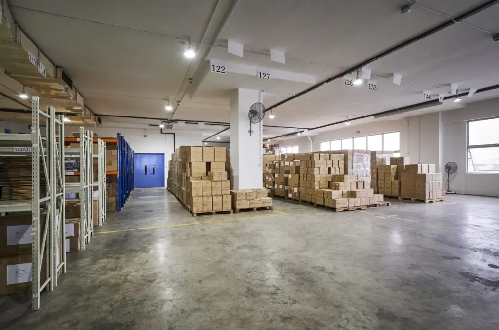 Functional warehouse workspace area highlighting professional commercial office renovation solutions for the Megcorp & Co project.