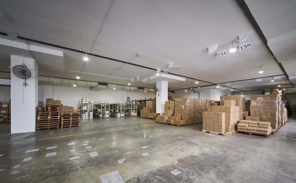 Functional warehouse workspace area featuring custom office interior design Singapore at Megcorp & Co Singapore.